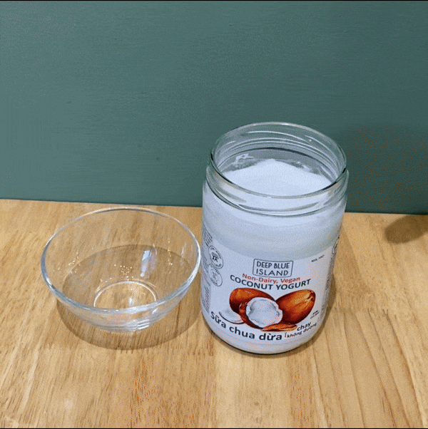 Spooning Deep Blue Island vegan coconut yogurtt into glass reveals a thick and creamy texture